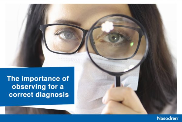 Doctor in protective medical mask looks through magnifying glass